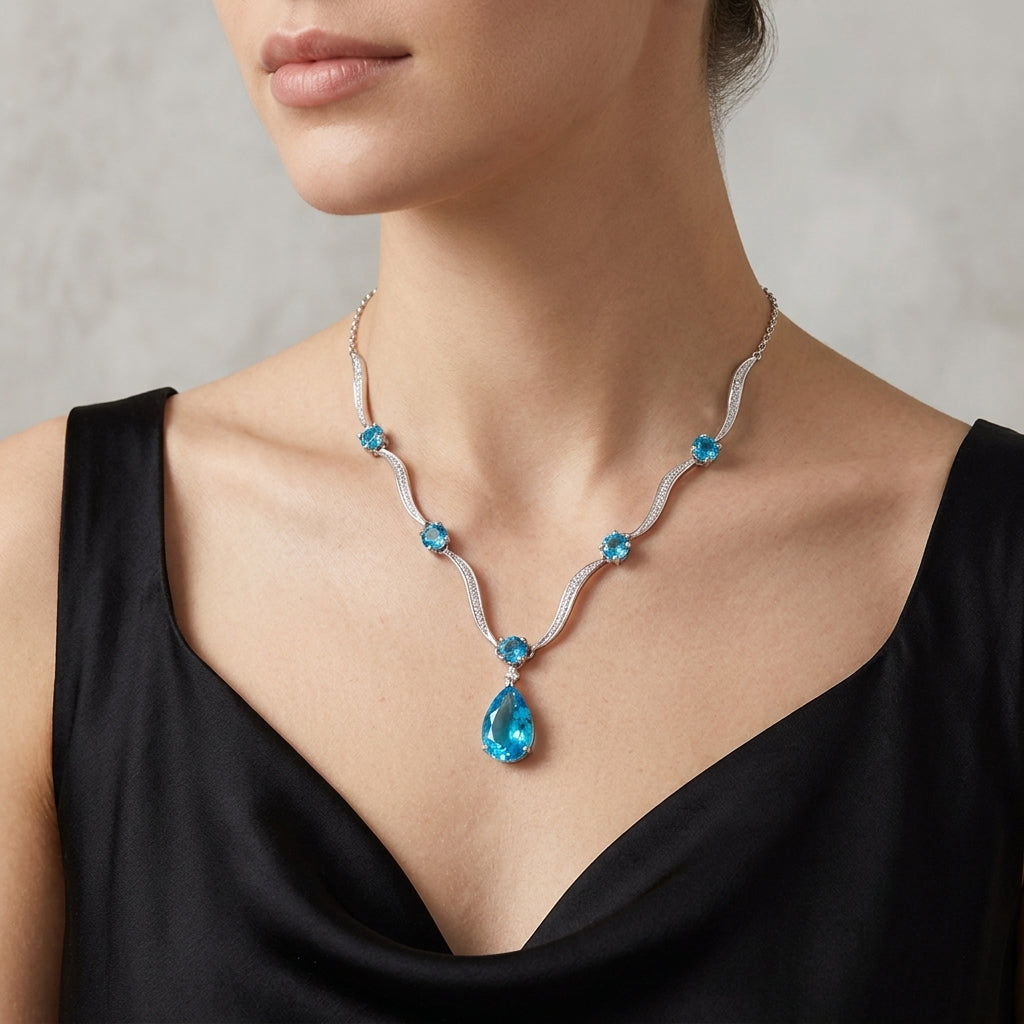 10K White Gold Blue Topaz Drop Necklace model still