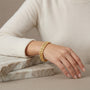 14K Yellow Gold Starburst Double Row Bracelet model still
