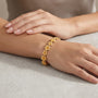 14K Gold Plumeria Flower Textured Link Bracelet model still