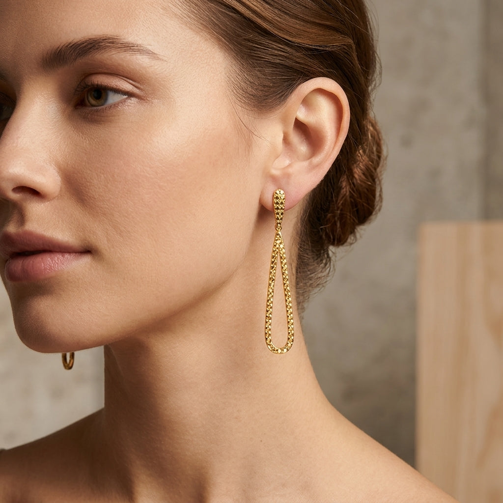 14K Yellow Gold Teardrop Geometric Diamond Cut Pattern Dangle Earrings model still