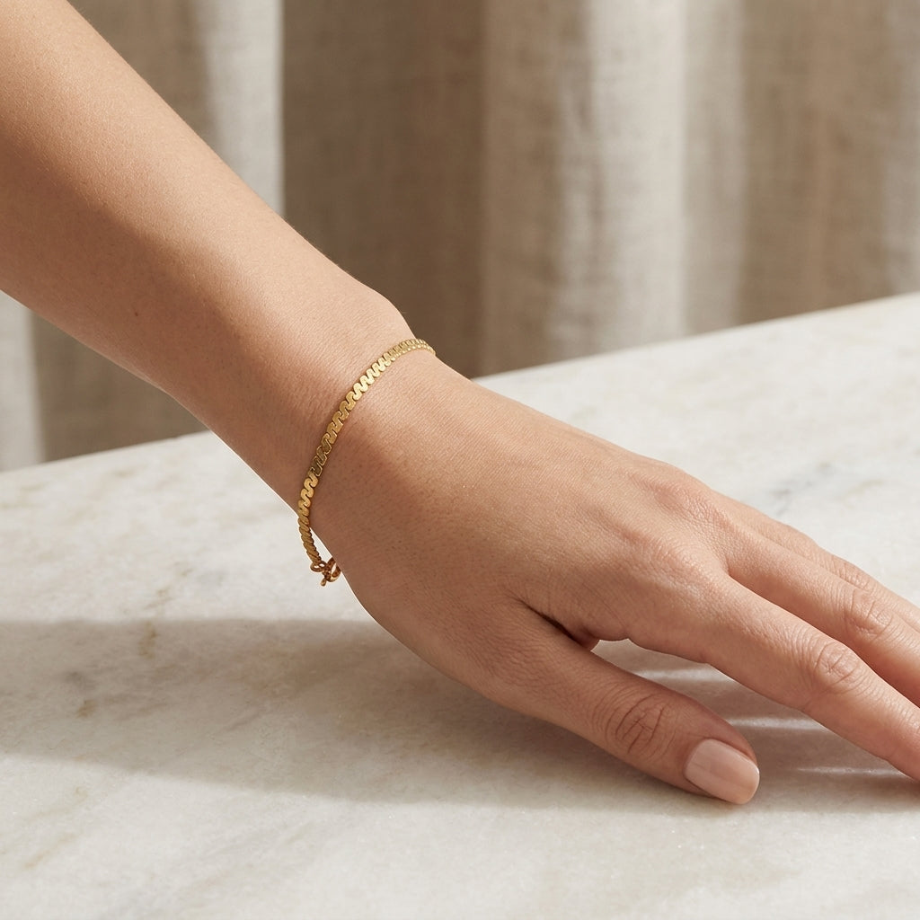 14K Yellow Gold Dainty Serpentine Link Chain Bracelet model still