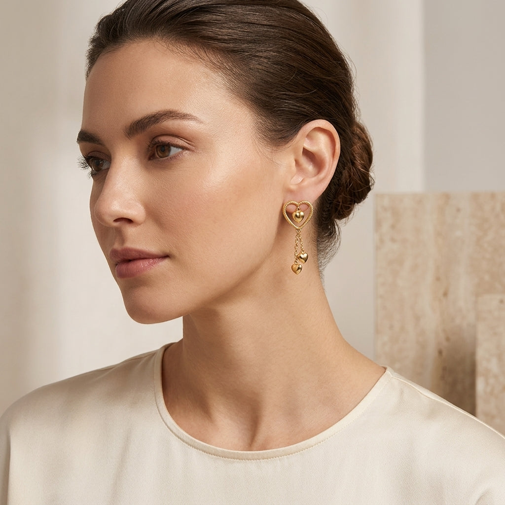 14K Gold Textured Open Heart & Heart Charm Charm Dangle Earrings model still