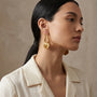 14K Gold Scalloped Shell Door Knocker Hoop Earrings model still