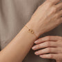 14K Interlocking Circle Charm Bracelet model still