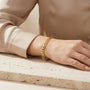 10K Gold Flat Figaro Link Bracelet model still